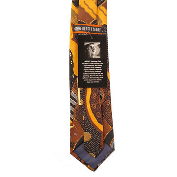 Australian made, polyester printed tie. Artwork by Norman Cox titled Kanga Story. Brown, olive, and grey tones. Large black, grey, circles within each other. Yellow ochre circular shapes, dot art.