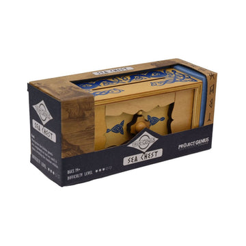 A wooden box puzzle is inside another packaging box with an open top. The puzzle is printed with blue symbols and the text 'True Genius Sea Chest' is written on the front of the packaging.