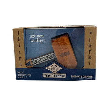 A wooden puzzle in the shape of a hammer is inside a packaging box with a clear window. The text 'Are you worthy?' and 'True Genius Thor's Hammer' is visible on the packaging.
