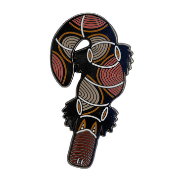 Enamel on metal brown, black and white platypus brooch by Ngarga-warendj. 