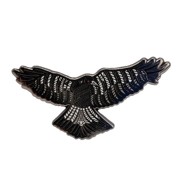 Enamel on metal black and white Australian magpie bird brooch by Ngarga-warendj. 