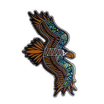Enamel on metal brown, black, white and blue wedge tailed eagle brooch in flight position by Ngarga-warendj. 