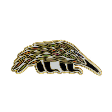 Enamel on metal black, white, green and red native Australian animal the echidna as a brooch. The echidna is in a standing position. 