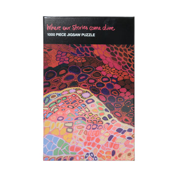 Box with a colourful indigenous artwork depicting corals during the day in a lighter colouring and during the night in a darker tone.