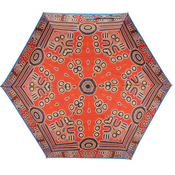 An open umbrella featuring artwork by Biddy Timms in red and black.