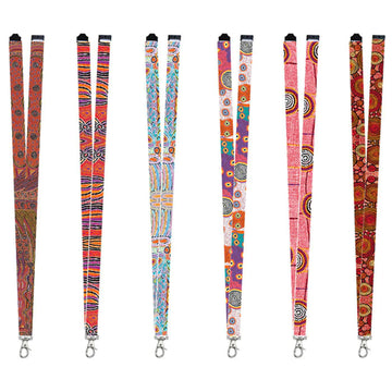 Six lanyards are laying flat and each printed with a different design by an Indigenous artist.