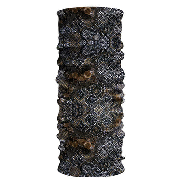 A piece of tubular fabric printed with artwork by Sonja Clark featuring black, white and brown circles made from dots.