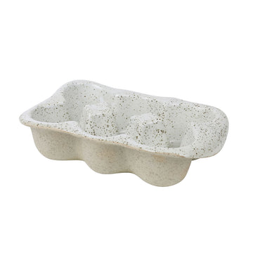 A ceramic egg crate with white on top and light brown underneath, covered with speckles.