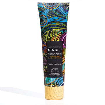 A small tube of hand cream featuring artwork by Justin Butler on the front with a black product label and wood look lid.