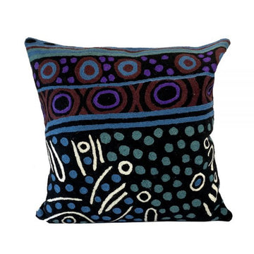 Woven woollen, zippered cushion cover 40cm x 40cm, stitched onto cotton base. Artwork by Julie Woods. Black, dark blue background. Circles, lines, dots, symbols in blue, purple, red ochre.
