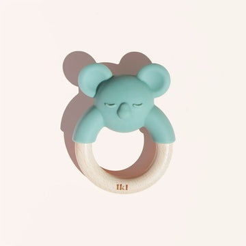 A wooden ring with silicone shaped koala on the top half.