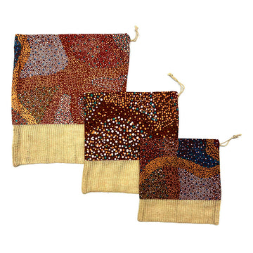 Three produce bags in different sizes. The top two thirds of the bag are printed with artwork by Lynette Nangala Brown and the bottom is hessian.