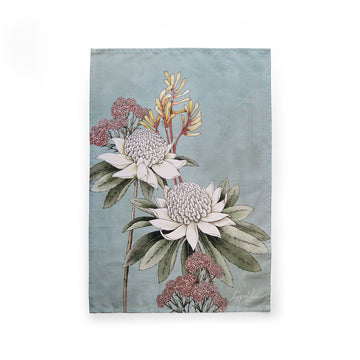 A blue tea towel printed with waratah flowers.