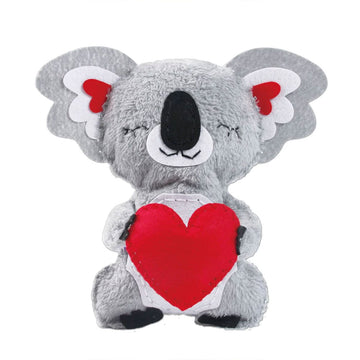 A cylinder container with the heading 'Sewing My First Doll Koala With Heart' with a photo of a koala toy holding a red heart.