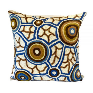 Woven woollen, zippered cushion cover 40cm x 40cm, stitched onto cotton base. Artwork by Bianca Gardiner-Dodd. Ochre coloured and blue concentric circles, connected by blue lines. Ochre linework, white background.