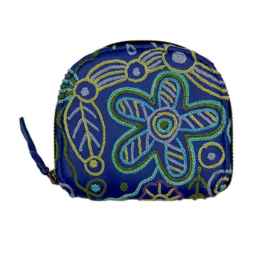 A blue coin purse embroidered with a floral design by Cedric Varcoe.