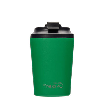 A reusable coffee cup in green with a black lid and the text 'made by Fressko' on the bottom.