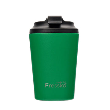 A green reusable coffee mug with a black lid and the text 'Made by Fressko' at the bottom.