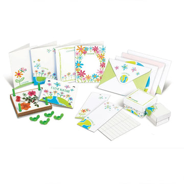 Front cover of pressed flower art kit box featuring images of pressed flowers and the tool used to press them.
