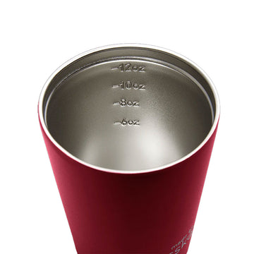 A dark red reusable coffee mug with a black lid and the text 'Made by Fressko' at the bottom.
