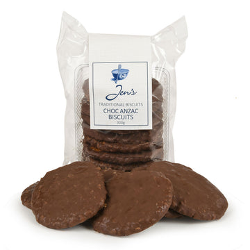 A packet of biscuits with a clear plastic covering and the heading 'Jen's Traditional Biscuits Choc Anzac Biscuits'. There are more biscuits in front of the packet.