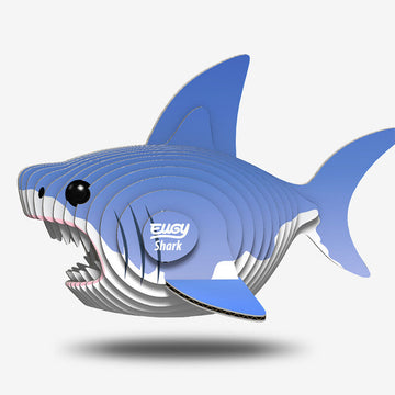 A 3D shark made from coloured cardboard stacked together.