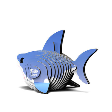 A 3D shark made from coloured cardboard stacked together.