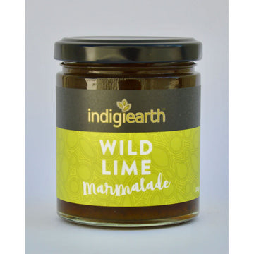 A clear jar with a black lid and wide product label around the jar. The label says 'Indigiearth Wild Lime Marmalade' on a green and black background.