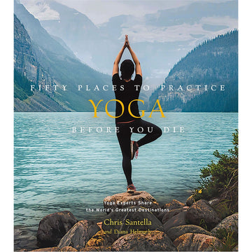 'Fifty Places to Practice Yoga Before You Die' book cover featuring a photo of the back of a person standing in a tree pose on rocks while looking towards water and mountains.