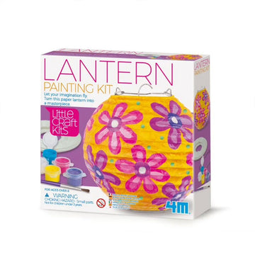 Front of a box titled 'Lantern Painting Kit' with an image of a yellow round lantern painted with pink and purple flowers. There are small paint points and a paint brush to the left on the box.