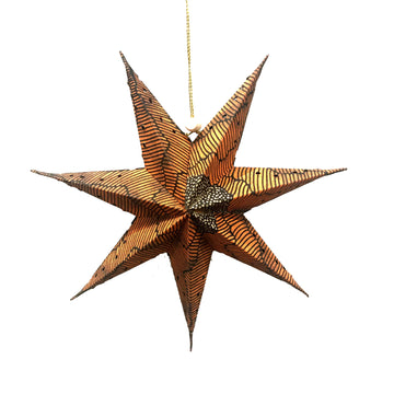 A seven pointed 3D star made from paper and printed with artwork by Damien and Yilpi Marks.