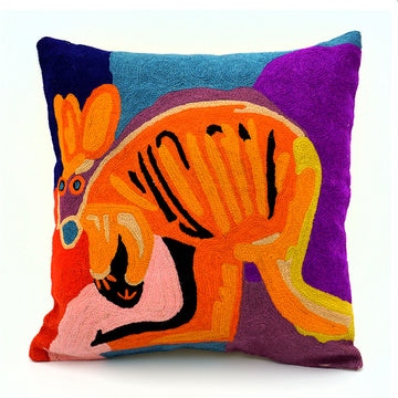 A cushion made from chain stitched wool with an illustration of an orange kangaroo on a purple, red and blue background.