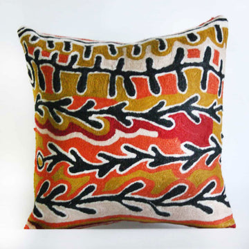 A woven cushion cover printed with artwork by Jorna Napurrurla Nelson.
