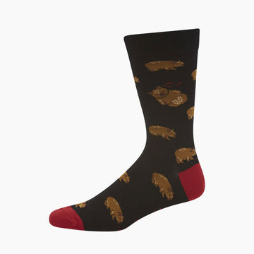 A black sock with a red heel and toe and printed with wombats.