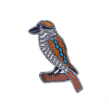 An enamel pin in the shape of a kookaburra.