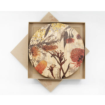 Round wooden placemats printed with colourful wildflowers in a square box.