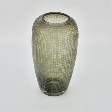 A tall vase with a rounded top and slightly tapered base in moss green glass with a grid pattern.
