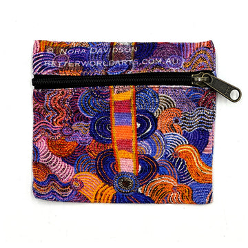 A square shaped pouch printed with artwork by Nora Nyutjanka Davidson with a black zipper across the top half.