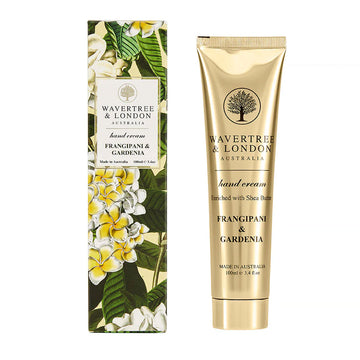 A skinny box printed with frangipanis and a white label with the text 'Wavertree & London handcream'. There is a gold tube next to the box.