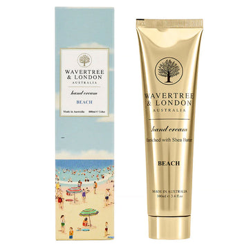 A skinny box printed with an illustration of the beach and the text 'Wavertree & London hand cream' in a white box. There is a gold tube of hand cream next to the box.