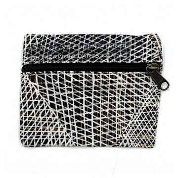 A square shaped pouch printed with artwork by Paulina Puruntatameri with a black zipper across the top half.
