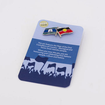 A pin featuring the Aboriginal and the Torres Strait Islander flags on a blue product card.