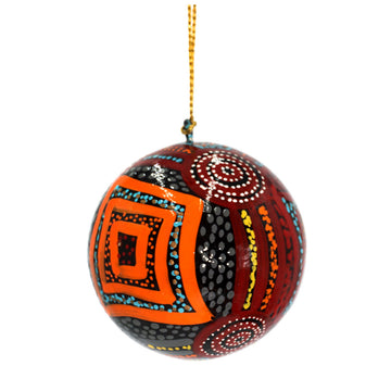 A Christmas bauble printed with artwork by Mary Napangardi Brown.