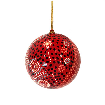 A Christmas bauble printed with artwork by Andrea Mimpitja Adamson.