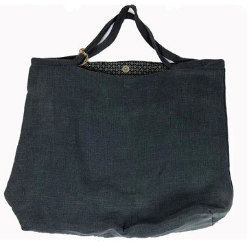 A charcoal tote bag is laying flat.