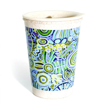 A bamboo travel mug printed with artwork by Cedric Varcoe in blue and green.