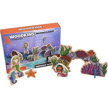 A wooden playset printed with mermaids, a seahorse and starfish in front of its box.