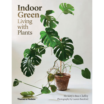 'Indoor Green Living With Plants' book cover featuring a photo of plant inside a distressed pot plant holder.