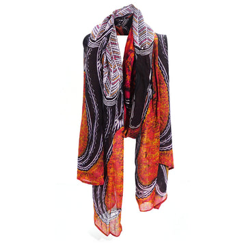 A cotton scarf printed with artwork by Edward Malati Yunupingu in black, white and orange.