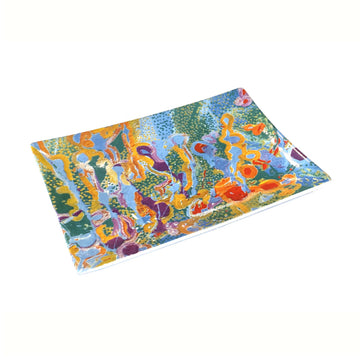 A rectangle shaped ceramic plate printed with artwork by Stephen Jupurrula Nelson in green, blue and yellow.